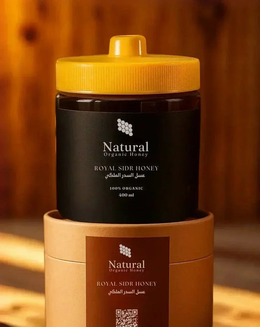 400ml jar of Natural Organic Royal Sidr Honey with yellow lid on cylindrical brown box