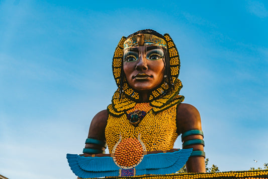 a statue of a woman with a bird on her shoulder