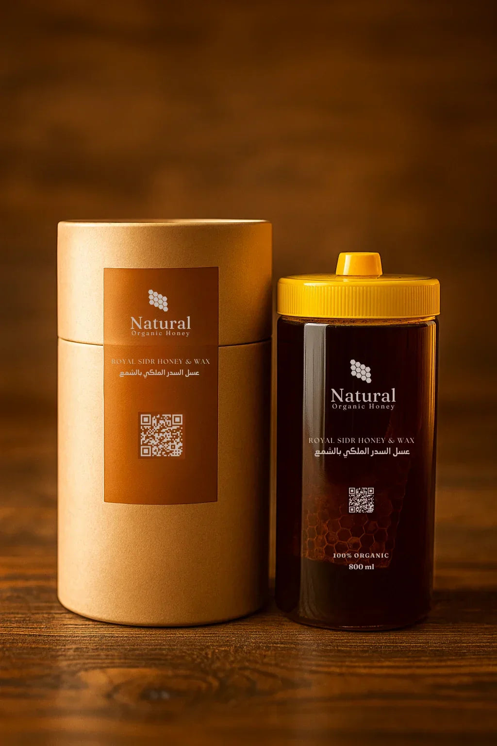 Natural Organic Honey container and cylindrical box labeled Royal Sidr Honey & Wax on wooden surface