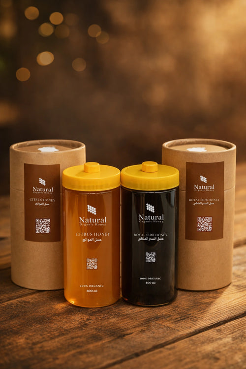 Natural Organic Honey citrus and royal sidr honey bottles with packaging on wooden table