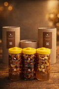 Luxury package of organic honey with nuts, featuring Natural Organic Honey jars on a wooden table.
